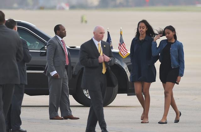 Malia (2nd R) and Sasha (R), the daughters of US President Barack Obama, walk to a vehicle upon arrival at Andrews Air Force Base in Maryland. (AFP) Malia (2nd R) and Sasha (R), the daughters of US President Barack Obama, walk to a vehicle upon arrival at Andrews Air Force Base in Maryland. (AFP)