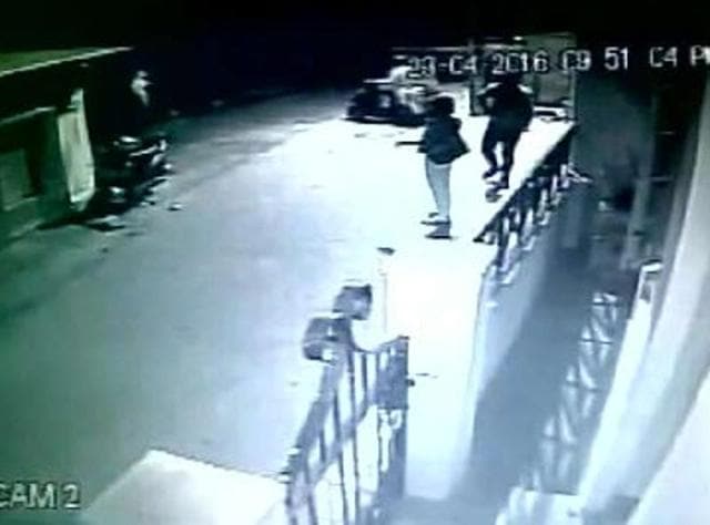 The incident was caught on a CCTV camera in which the woman is seen being physically lifted and carried away by the man from behind as she was speaking on her mobile phone in front of her paying guest (PG) accommodation. (Screengrab) The incident was caught on a CCTV camera in which the woman is seen being physically lifted and carried away by the man from behind as she was speaking on her mobile phone in front of her paying guest (PG) accommodation. (Screengrab)