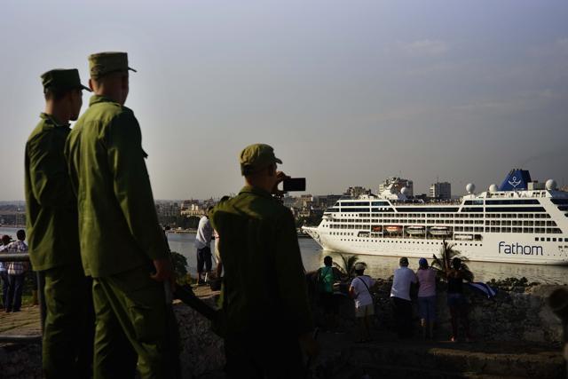 Cuban soldiers watch the Carnival Adonia cruise ship arrive from Miami, in Havana, Cuba, Monday, May 2, 2016. (AP) Cuban soldiers watch the Carnival Adonia cruise ship arrive from Miami, in Havana, Cuba, Monday, May 2, 2016. (AP)