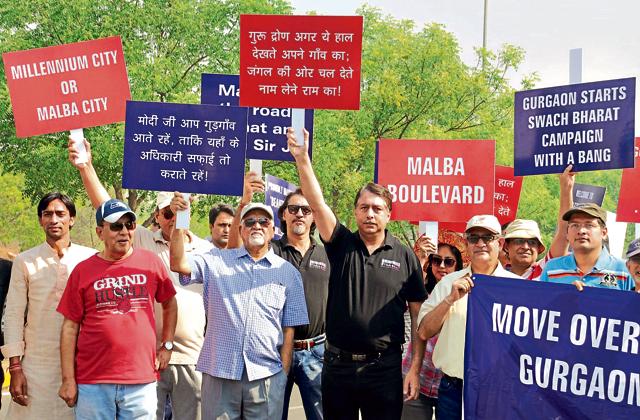 Residents of various condominiums and schoolchildren (right) protest against construction waste being dumped on forest land opposite Le Meridien Hotel in Gurgaon, on Sunday.(Parveen Kumar/HT Photo) Residents of various condominiums and schoolchildren (right) protest against construction waste being dumped on forest land opposite Le Meridien Hotel in Gurgaon, on Sunday.(Parveen Kumar/HT Photo)