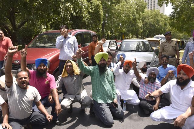 Cab owners protest a day after the ban on diesel taxis in the national capital came into effect. The cab drivers, Owners blocked traffic on Ashoka Road near Parliament Street in New Delhi. (Photo by Arvind Yadav/ Hindustan Times) (Hindustan Times) Cab owners protest a day after the ban on diesel taxis in the national capital came into effect. The cab drivers, Owners blocked traffic on Ashoka Road near Parliament Street in New Delhi. (Photo by Arvind Yadav/ Hindustan Times) (Hindustan Times)