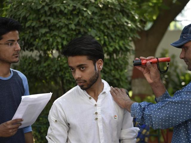 Students appearing for the National Eligibility and Entrance Test are scanned before being allowed into the exam hall. (Vipin Kumar/HT Photo) Students appearing for the National Eligibility and Entrance Test are scanned before being allowed into the exam hall. (Vipin Kumar/HT Photo)