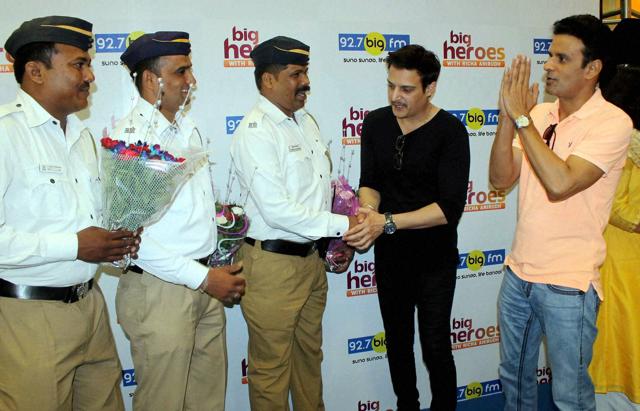 Jimmy Shergill and Manoj Bajpayee with Traffice personal during promotion of film Traffic at BIG FM studio in Mumbai on Tuesday. (PTI) Jimmy Shergill and Manoj Bajpayee with Traffice personal during promotion of film Traffic at BIG FM studio in Mumbai on Tuesday. (PTI)