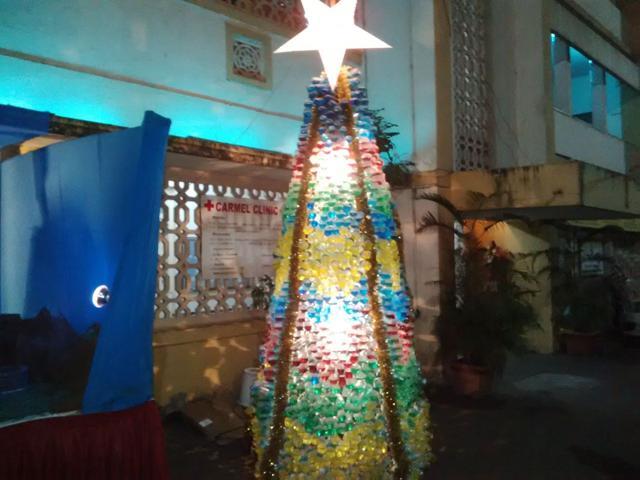A tree made out of empty bottles.
