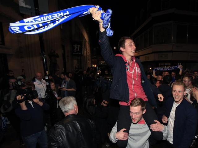 Leicester City fans celebrate in the streets of Leicester after seeing their side crowned English Premier League soccer champions. (AP) Leicester City fans celebrate in the streets of Leicester after seeing their side crowned English Premier League soccer champions. (AP)