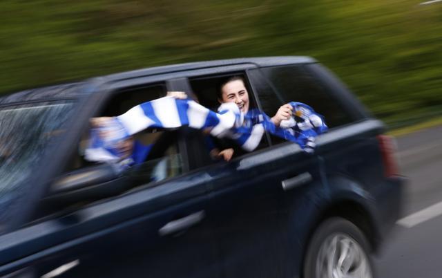 Leicester City fans outside Jamie Vardy's home (REUTERS)