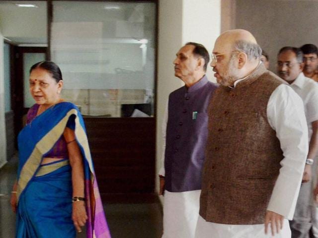 BJP president Amit Shah, Gujarat CM Anandiben Patel and state BJP chief Vijay Rupani in Gandhinagar.(PTI File Photo)