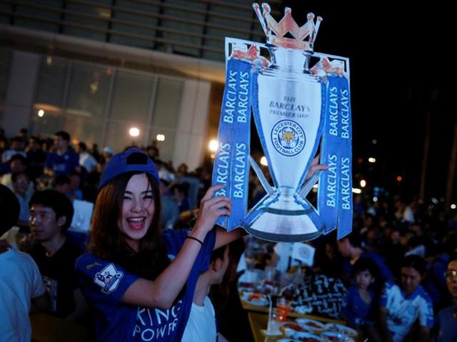 Leicester City fans celebrate after their team drew against Manchester United.(REUTERS)