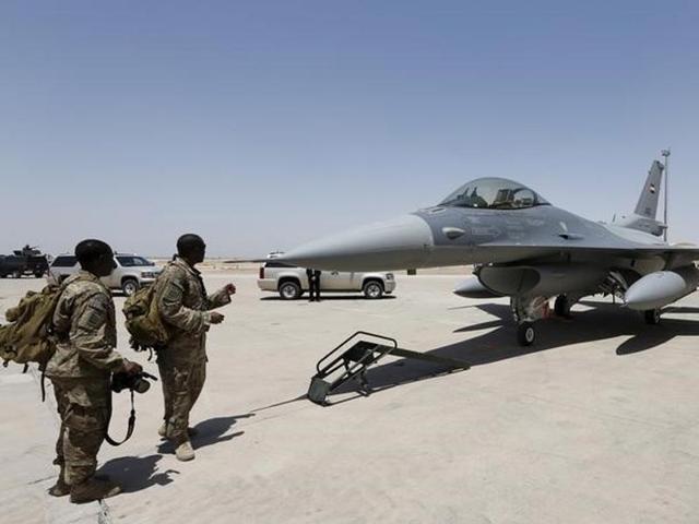 US soldiers look at a F-16 fighter jet during an official ceremony to receive four of these aircrafts at a military base in Balad, Iraq. (Reuters) US soldiers look at a F-16 fighter jet during an official ceremony to receive four of these aircrafts at a military base in Balad, Iraq. (Reuters)