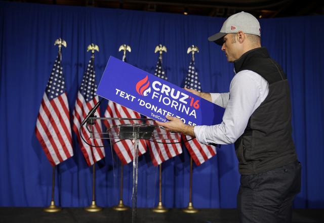 A worker for Republican presidential candidate, senator Ted Cruz, removes the campaign sign from the podium following primary night campaign event in Indianapolis. (AP Photo) A worker for Republican presidential candidate, senator Ted Cruz, removes the campaign sign from the podium following primary night campaign event in Indianapolis. (AP Photo)