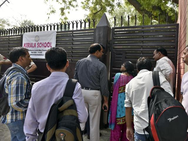 New Delhi, India - May 1, 2016: The parents peeping through the gate as students went inside the examination center for "NEET" exam at Kerala School in New Delhi, India, on Sunday, May 1, 2016. (Photo by Sushil Kumar/ Hindustan Times)(Hindustan Times)