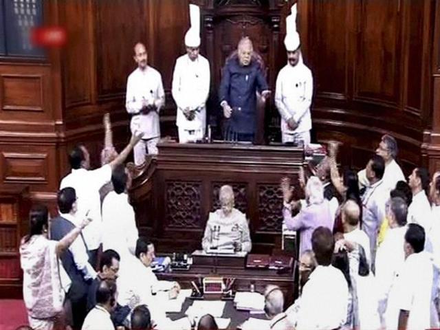 Members protest in the well of the Rajya Sabha in New Delhi on Monday. (PTI) Members protest in the well of the Rajya Sabha in New Delhi on Monday. (PTI)