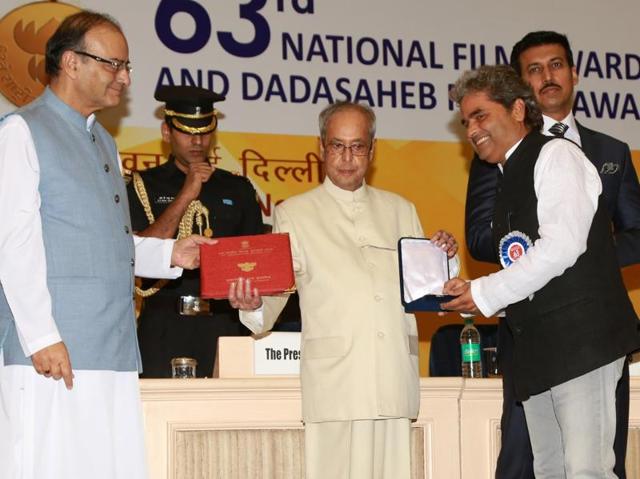 Filmmaker Vishal Bhardwaj receives the Best Screenplay Writer (adapted) Award for Talvar from President Pranab Mukherjee during the 63rd National Film Awards ceremony at Vigyan Bhawan in New Delhi.  (IANS) 