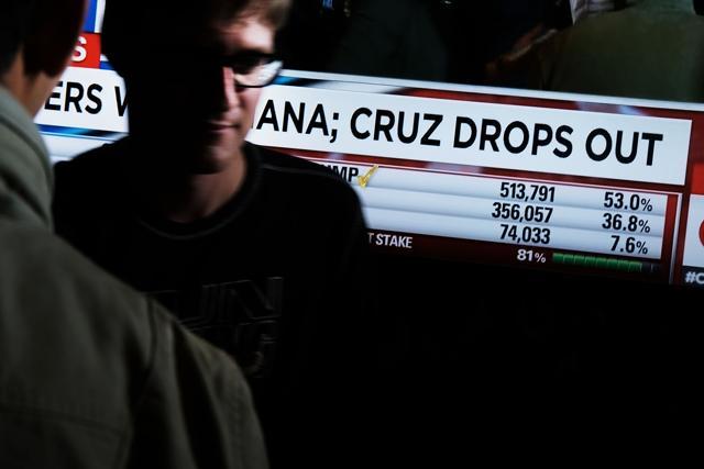 A live television screen at the Trump Tower displays the news to Trump supporters and journalists that Ted Cruz is pulling out of the presidential campaign after losing Indiana. (AFP) A live television screen at the Trump Tower displays the news to Trump supporters and journalists that Ted Cruz is pulling out of the presidential campaign after losing Indiana. (AFP)
