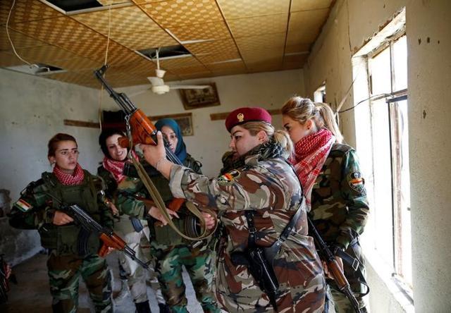 Haseba Nauzad (second from right) with her comrades at the site in Nawaran in Iraq. (Reuters) Haseba Nauzad (second from right) with her comrades at the site in Nawaran in Iraq. (Reuters)