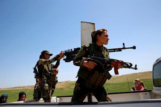 The women riding a pickup truck near the frontline of their fight against Islamic State militants in Iraq. (Reuters) The women riding a pickup truck near the frontline of their fight against Islamic State militants in Iraq. (Reuters)