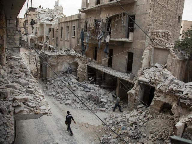 A Syrian man walks past destroyed buildings on May 2, 2016 in Aleppo's Bab al-Hadid neighbourhood which was targeted recently by regime air strikes (AFP) A Syrian man walks past destroyed buildings on May 2, 2016 in Aleppo's Bab al-Hadid neighbourhood which was targeted recently by regime air strikes (AFP)