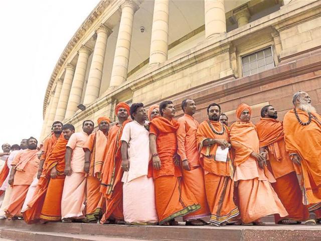 Sadhus wait in line to enter the Visitor’s Gallery at Parliament House on Thursday. (Sonu mehta/HT photo) Sadhus wait in line to enter the Visitor’s Gallery at Parliament House on Thursday. (Sonu mehta/HT photo)