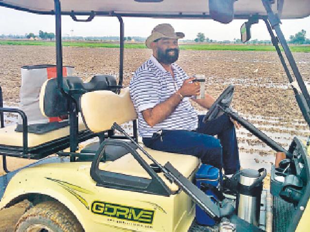 Amarjit Singh Dullet driving his electric golf cart. (HT Photo) Amarjit Singh Dullet driving his electric golf cart. (HT Photo)