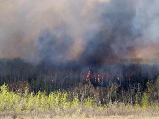 A wildfire rages through Fort McMurray. (AP)
