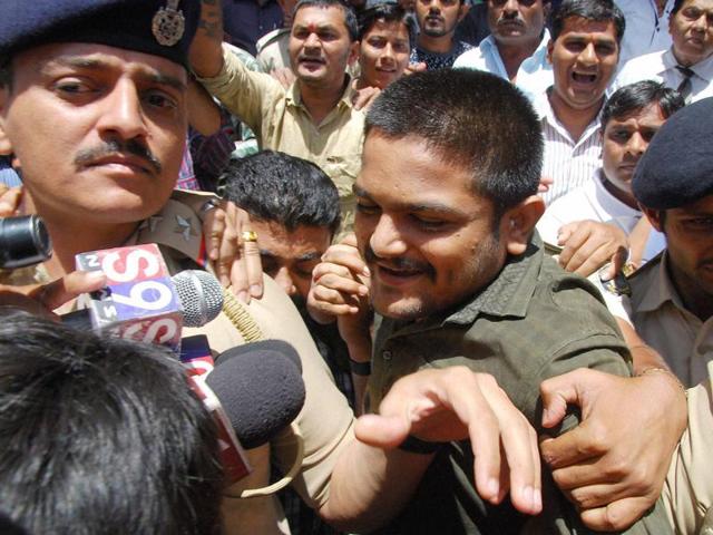 Police produce PAAS convener Hardik Patel at a court in Surat. (PTI) Police produce PAAS convener Hardik Patel at a court in Surat. (PTI)