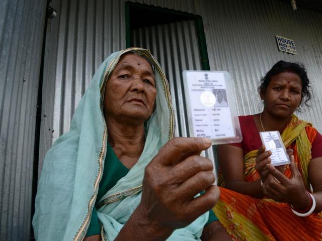 Santi Bala (left) poses with her new voter identity card at Dinhata Enclave settlement camp in Cooch Behar district, on the eve of voting in the final phase of West Bengal assembly elections. (AFP Photo) Santi Bala (left) poses with her new voter identity card at Dinhata Enclave settlement camp in Cooch Behar district, on the eve of voting in the final phase of West Bengal assembly elections. (AFP Photo)