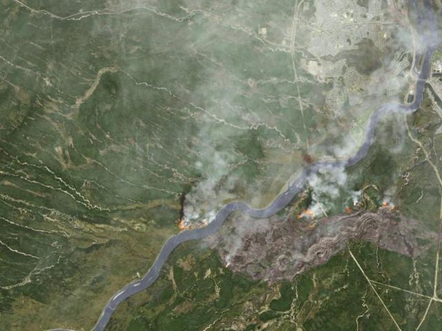 Smoke from wildfires near Fort McMurray, Alberta are shown in this satellite photo from NASA. (Courtesy NASA/Handout via REUTERS)