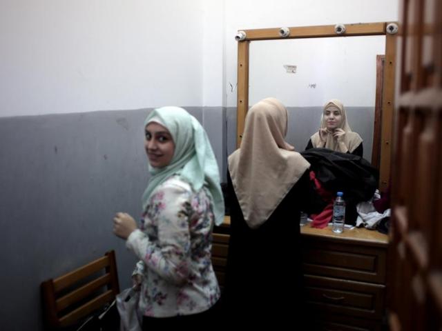 Palestinian actresses prepare themselves in a room to perform a Gaza version of Shakespeare's "Romeo and Juliet" play on the stage of a cultural centre in Gaza City. (AP) Palestinian actresses prepare themselves in a room to perform a Gaza version of Shakespeare's "Romeo and Juliet" play on the stage of a cultural centre in Gaza City. (AP)