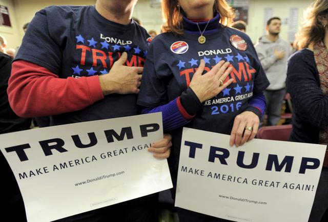 In this file photo, supporters of US Republican presidential candidate Donald Trump hold their hands to their chest as the national anthem is played at a campaign rally in Concord, New Hampshire. (REUTERS) In this file photo, supporters of US Republican presidential candidate Donald Trump hold their hands to their chest as the national anthem is played at a campaign rally in Concord, New Hampshire. (REUTERS)