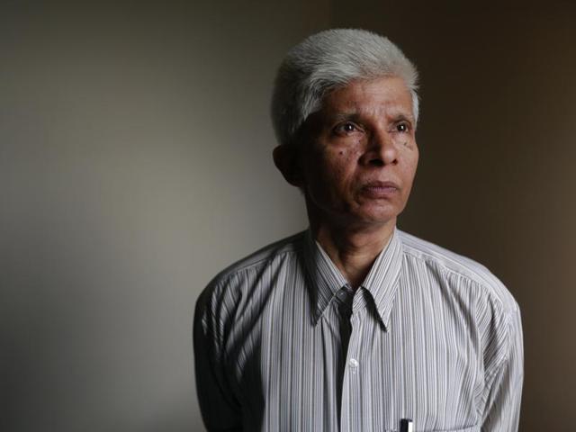Dhaka University professor Azizur Rahman works on his computer at his home in Dhaka, Bangladesh. He is among a growing number of political moderates and intellectuals seeking protection in Bangladesh, where at least 15 writers, activists, religious minorities and foreign aid workers have been killed in targeted attacks since the start of 2015. (AP)