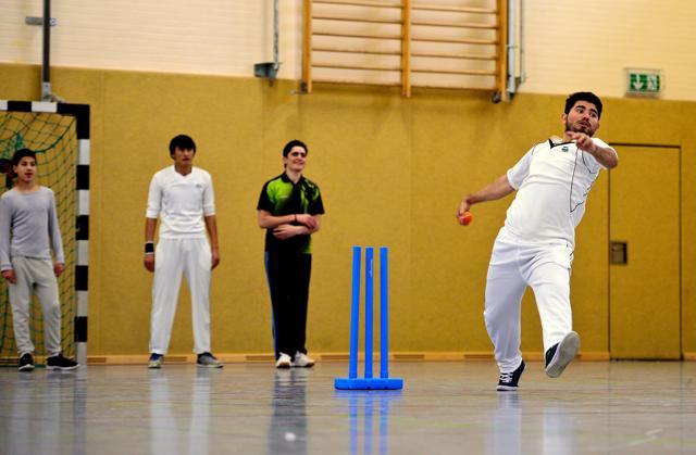 Afghan refugees takes part in a cricket training session at the team of the Altendorf 09 Blue Tigers in Essen. (AFP)