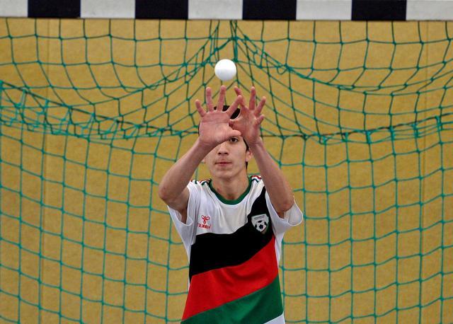 An Afghan refugee takes part in a cricket training session at the team of the Altendorf 09 Blue Tigers in Essen, western Germany. (AFP)