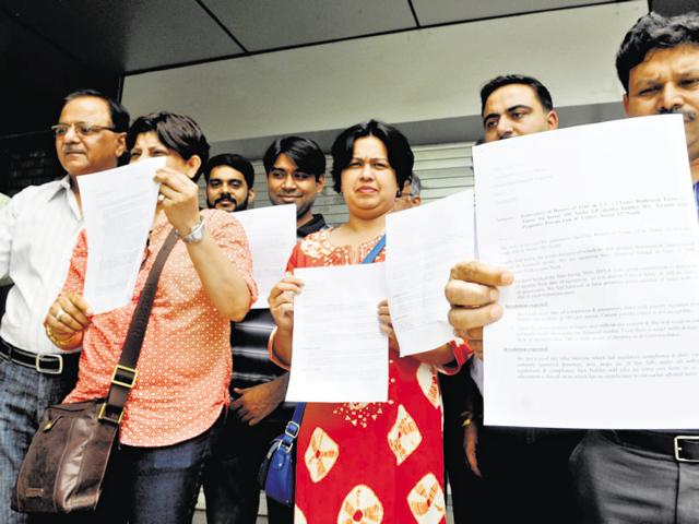 A delegation of homebuyers who bought housing projects developed by 3C Developers met authority officials on Friday. (Sunil Ghosh/HT Photo) A delegation of homebuyers who bought housing projects developed by 3C Developers met authority officials on Friday. (Sunil Ghosh/HT Photo)
