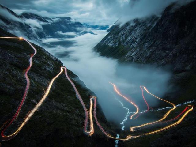 ‘Trollstigen’ in Bø, More og Romsdal, Norway: I took this photo in july 2014 at Trollstigen in Norway. Standing there alone in the fog, I was waiting for the view to become clear. And then it happened, the fog disappeared and though it was 1 am already, one car came slowly up the steep serpentines. It was my dream for a long time to take a photo of lighttrails like this in Norway - and it was just an awesome feeling that it worked out on the most beautiful and famous street. A few minutes later the fog returned, even thicker than before. (Photo and caption by Christoph Schaarschmidt) (National Geographic)