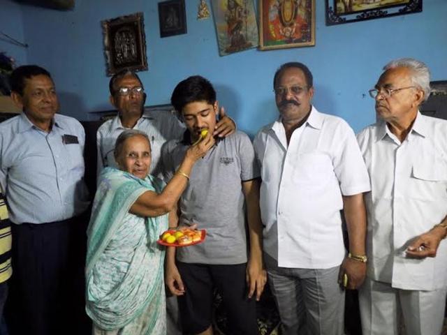 Abineet Parichha, who topped ICSE’s class 10 exam at all-India level with his family members at home in Balangir. (Arabinda Mahapatra/HT Photo) Abineet Parichha, who topped ICSE’s class 10 exam at all-India level with his family members at home in Balangir. (Arabinda Mahapatra/HT Photo)