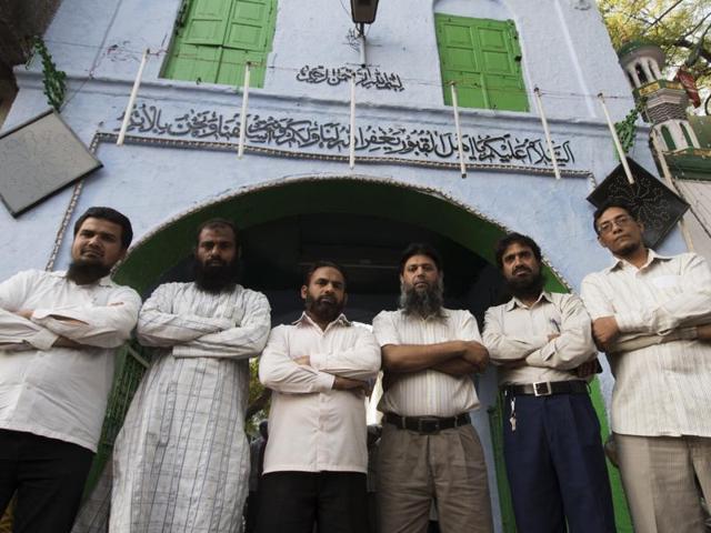(From left) Six of the nine acquitted of the terror charges - Noorul Huda, Mohammad Zahid, Raees Ahmed, Dr Farogh Makhdoomi, Dr Salman Farsi, and Abrar Ahmed - stand outside Malegaon’s Hamidia Mosque, where explosions took place in 2006.(Athar Rather/ HT Photo)