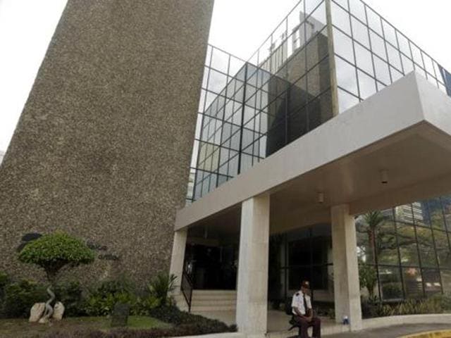 A security guard sits outside the Mossack Fonseca law firm in Panama City. (AP) A security guard sits outside the Mossack Fonseca law firm in Panama City. (AP)