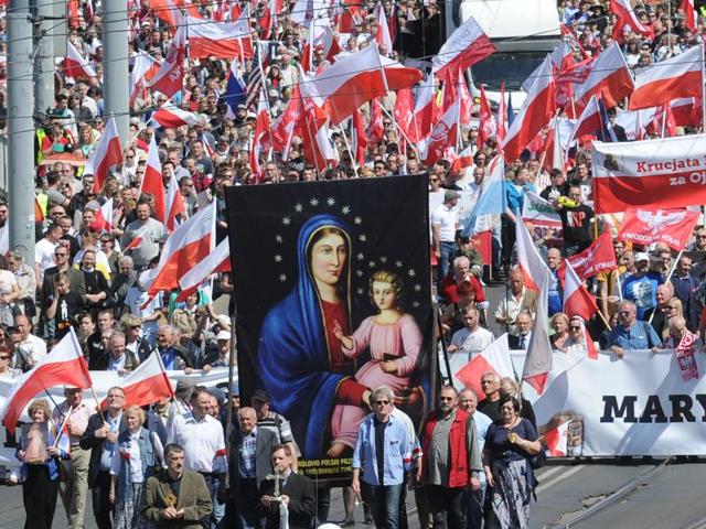 Nationalist and Catholic activists march through the downtown in a protest against the European Union, in Warsaw, Poland. (AP Photo) Nationalist and Catholic activists march through the downtown in a protest against the European Union, in Warsaw, Poland. (AP Photo)