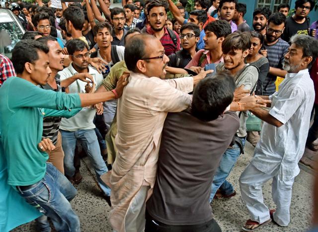 ABVP activists clash with Jadavpur University Students who stopped the car of film director Vivek Agnihotri during their agitation against screening of his film 'Buddha in a Traffic Jam' on May 6. (PTI) ABVP activists clash with Jadavpur University Students who stopped the car of film director Vivek Agnihotri during their agitation against screening of his film 'Buddha in a Traffic Jam' on May 6. (PTI)