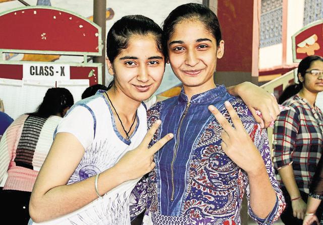 Parneet Kaur (left) with elder sister Amandeep Kaur celebrating their success in Ludhiana on Friday. (JS Grewal/HT Photo) Parneet Kaur (left) with elder sister Amandeep Kaur celebrating their success in Ludhiana on Friday. (JS Grewal/HT Photo)