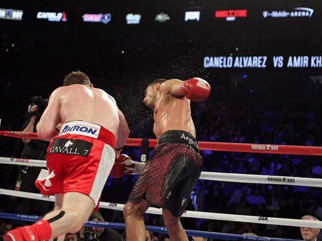 Canelo Alvarez watches after knocking down Amir Khan during their WBC middleweight title fight. (AP) Canelo Alvarez watches after knocking down Amir Khan during their WBC middleweight title fight. (AP)