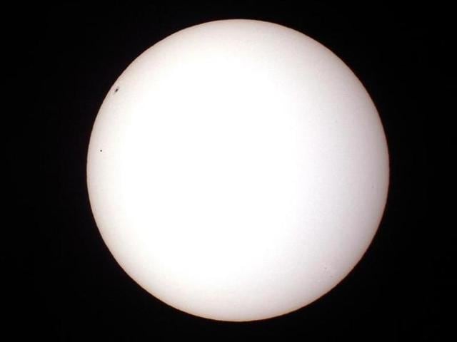 The planet Mercury (small dot on left) passes in front of the Sun and below a large sunspot as seen through a solar filtered telescope from Palm Beach Gardens, Florida. (Reuters File Photo) The planet Mercury (small dot on left) passes in front of the Sun and below a large sunspot as seen through a solar filtered telescope from Palm Beach Gardens, Florida. (Reuters File Photo)