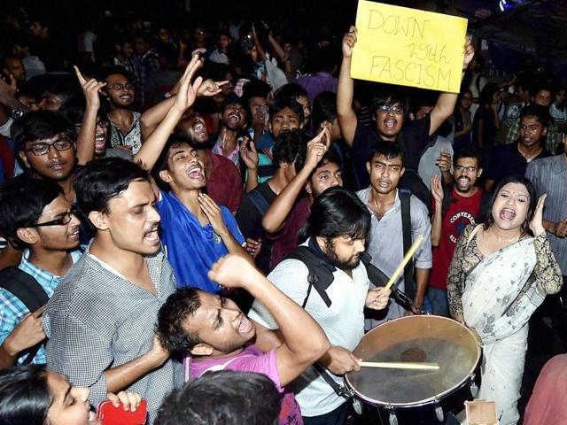 Students of Jadavpur University play drums and shout slogans in a protest rally against alleged attack by ABVP activists in Kolkata on Saturday evening.(PTI)