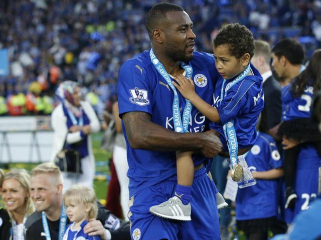 Leicester City's Wes Morgan celebrates with his son at The King Power Stadium. (REUTERS) 