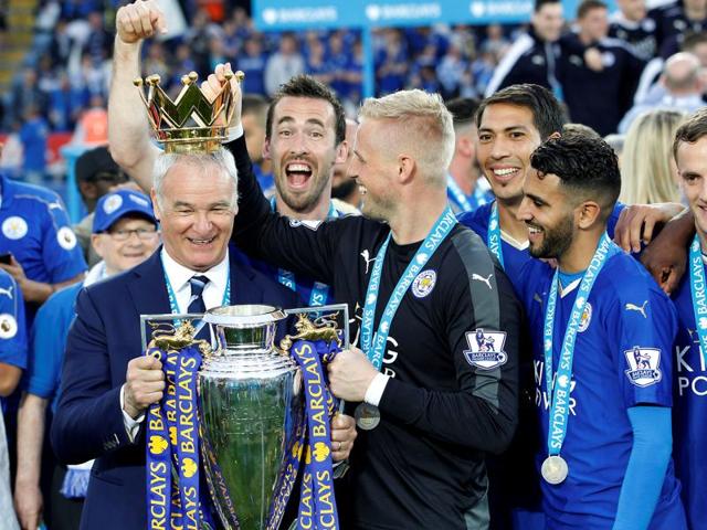 Leicester City manager Claudio Ranieri, Kasper Schmeichel (2nd L) and Riyad Mahrez (2nd R) pose with the trophy as they celebrate winning the Barclays Premier League. (REUTERS) Leicester City manager Claudio Ranieri, Kasper Schmeichel (2nd L) and Riyad Mahrez (2nd R) pose with the trophy as they celebrate winning the Barclays Premier League. (REUTERS)
