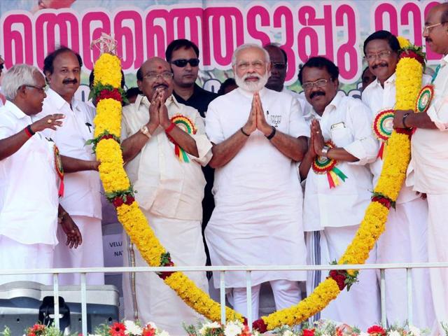 Prime Minister Narendra Modi garlanded at an assembly elections meeting at Alappuzha in Kerala. (PTI) Prime Minister Narendra Modi garlanded at an assembly elections meeting at Alappuzha in Kerala. (PTI)
