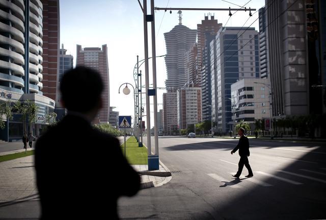 A North Korean man crosses the road in Pyongyang's newest residential development, Mirae Scientists Street in Pyongyang, North Korea on Saturday. (AP) A North Korean man crosses the road in Pyongyang's newest residential development, Mirae Scientists Street in Pyongyang, North Korea on Saturday. (AP)
