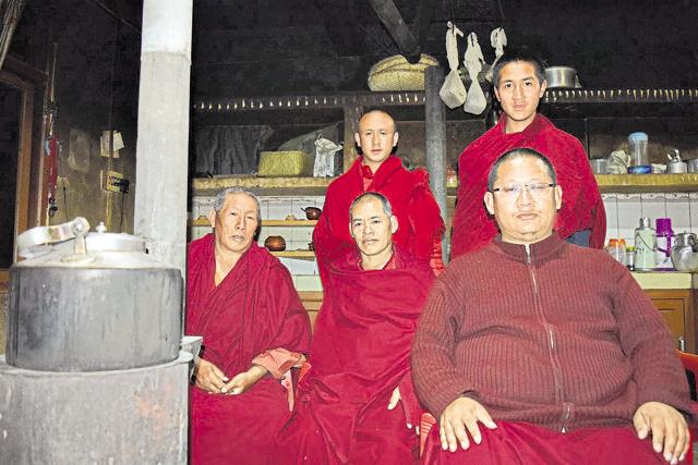 Lama Lobsang Gyatso (right), head of the anti-dam Save Mon Region Federation, with monks at Tawang monastery. (Rahul Karmakar/HT Photo)