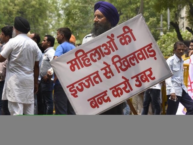 Members of Delhi Taxi Tourist Transporters Association protest against taxi aggregators Ola and Uber outside Delhi chief minister Arvind Kejriwal’s residence. An Ola cab driver was arrested for allegedly molesting a Belgian woman in Gurgaon on Sunday. Photo by Sonu Mehta/Hindustan Times) (Hindustan Times) Members of Delhi Taxi Tourist Transporters Association protest against taxi aggregators Ola and Uber outside Delhi chief minister Arvind Kejriwal’s residence. An Ola cab driver was arrested for allegedly molesting a Belgian woman in Gurgaon on Sunday. Photo by Sonu Mehta/Hindustan Times) (Hindustan Times)
