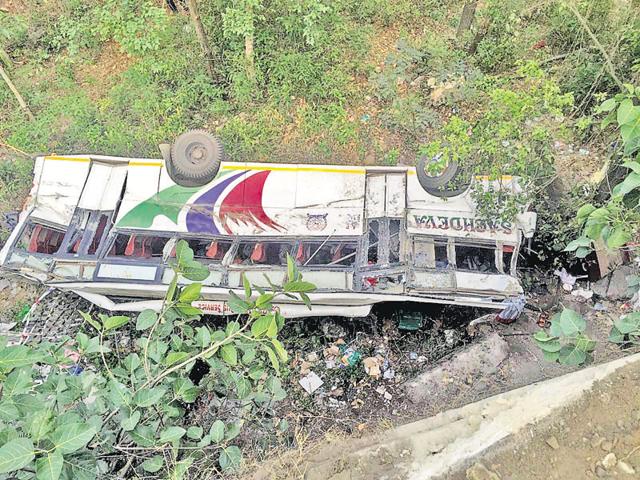 A private bus (PB-02-CR-5571)— on its way from Amritsar’s Chaitta village to the revered shrine of Jwalaji in Kangra district — skidded off the road and rolled down a gorge near Dhaliara, around 60km from Dharamshala (HT Photo) A private bus (PB-02-CR-5571)— on its way from Amritsar’s Chaitta village to the revered shrine of Jwalaji in Kangra district — skidded off the road and rolled down a gorge near Dhaliara, around 60km from Dharamshala (HT Photo)